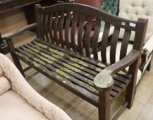 A wooden garden bench, W.156cm