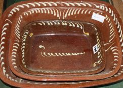 Three 19th century slip-decorated baking dishes