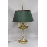 A brass bouillotte style lamp, with shade
