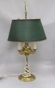 A brass bouillotte style lamp, with shade