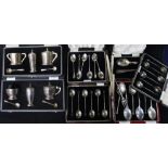 Two cased silver three piece condiment sets, five other cased sets of cutlery and other items.