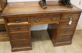 An Edwardian walnut kneehole desk, W.123cm