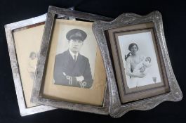 Three assorted early 20th century silver photograph frames, all approximately 24cm.