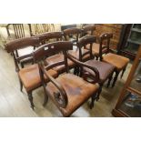 A set of seven early Victorian leather seat dining chairs