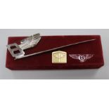 An 18ct gold Bentley key ring and Bentley letter opener in box.