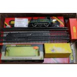 A collection of toy railway engines in a case, etc and pine display case