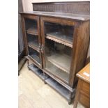 A 1920's glazed two door bookcase, W.120cm