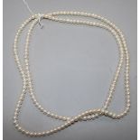 An opera length single strand cultured pearl necklace, 116cm.
