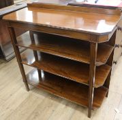 A Regency style walnut four tier buffet, W.102cm