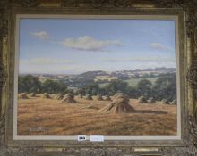 David Morgan (b. 1964), oil on canvas, harvest landscape with corn stacks, signed, 45 x 59.5cm