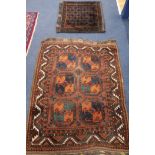 A Persian rust ground rug and a saddlebag, 130 x 100cm