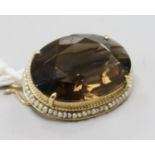 A 14ct gold quartz and seed pearl set oval brooch, 28mm.