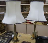 A pair of brass table lamps