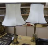 A pair of brass table lamps