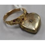 A late 19th/early 20th century gold and gem set ring and a diamond set heart shaped yellow metal.
