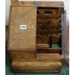 A walnut stationery cabinet