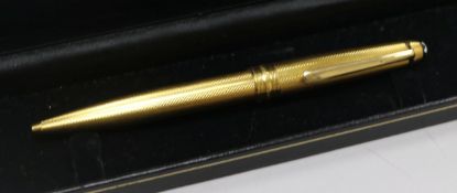 A yellow metal Mont Blanc Meisterstuck ballpoint pen.