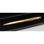 A yellow metal Mont Blanc Meisterstuck ballpoint pen.