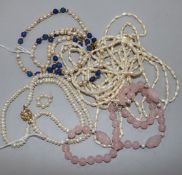 Four various necklaces, including a five-strand freshwater pearl necklace with 'bow' clasp, a single