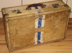 A white vellum travelling suitcase