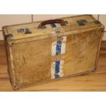 A white vellum travelling suitcase