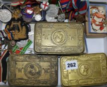 A collection Military tobacco tins, medals, etc.