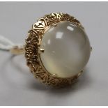 A yellow metal and chatoyant cabochon quartz dress ring, size Q.