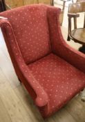 An upholstered wingback armchair