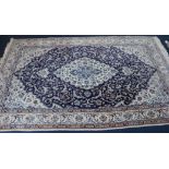 A Tabriz style cream ground rug, 255 x 158cm