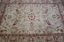An fawn ground rug and a Persian red ground runner, 240 x 172cm and 250 x 62cm