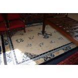 A large blue and white Chinese rug, 350 x 255cm