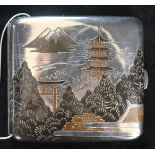 A Japanese silver and mixed metal cigarette case.