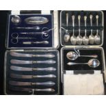 A six-piece silver-mounted manicure set, cased and three cased sets of flatware, including six