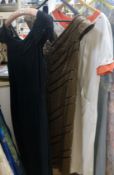 A 1930's/40's cream and orange day dress, black cocktail dress and a brown bead dress