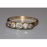 An 18ct gold and graduated five stone diamond ring, size R.