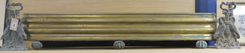 A pair of brass door stops and fender