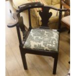 A George III mahogany corner chair with shaped splats and drop-in seat