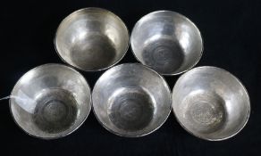 Five Indian white metal bowls. with engraved decoration.