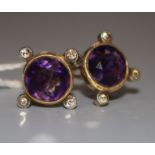 A pair of 9ct gold, amethyst and diamond ear clips.