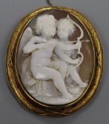 A Victorian yellow metal mounted cameo brooch, carved with Cupids, 62mm.