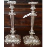 A pair of plated candlesticks