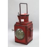 A red British rail lamp