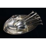 A sterling silver shell shaped dish and a set of six silver teaspoons.