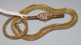 An early 20th century 15ct gold, peridot and seed pearl bar brooch and a 9ct gold necklace.