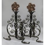 A pair of Arts & Crafts wrought iron and copper fire dogs