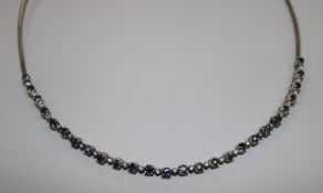 A white metal, sapphire and diamond line bracelet, now mounted on a silver wire necklet.