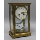 A late 19th century French brass four glass mantel clock