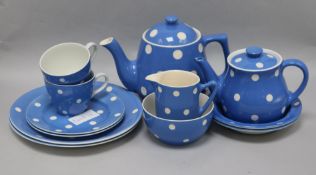 A blue polka dot tea service