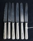 A set of six George IV silver handled thread and shell pattern table knives.