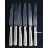 A set of six George IV silver handled thread and shell pattern table knives.